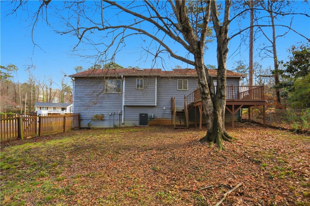 4899 Hawk Trail Marietta, GA 30066 - Photo 29 of 35 a view of a house with a yard