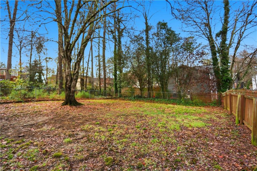 4899 Hawk Trail Marietta, GA 30066 - Photo 31 of 35 a backyard of a house with lots of green space