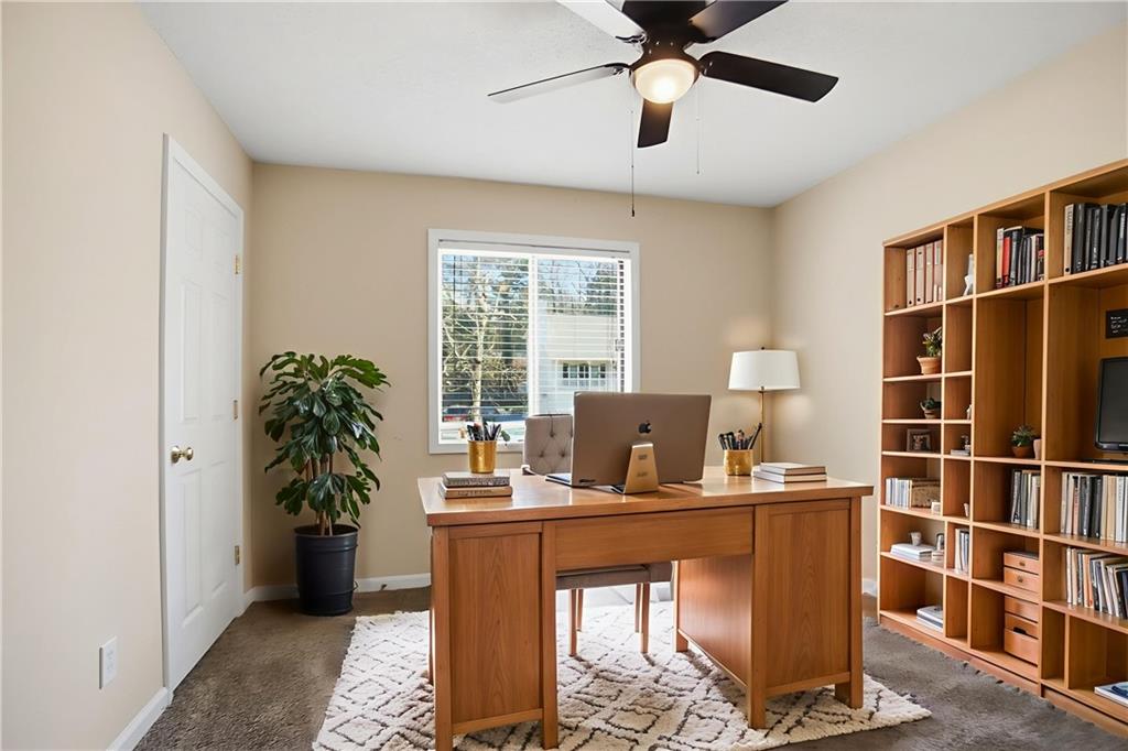 4899 Hawk Trail Marietta, GA 30066 - Photo 5 of 35 a work room with furniture and a potted plant