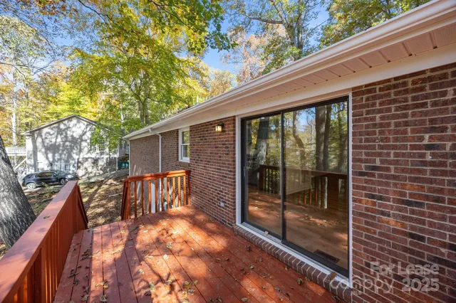 a view of two chairs in the balcony