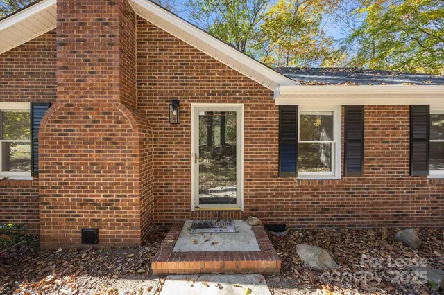 a front view of a house with glass windows