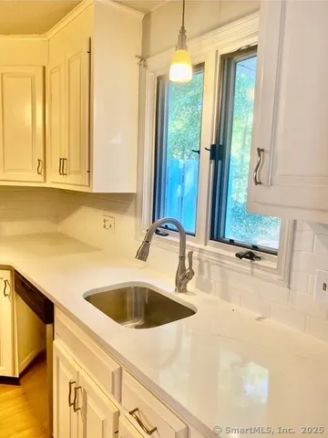 a kitchen with a refrigerator and a stove