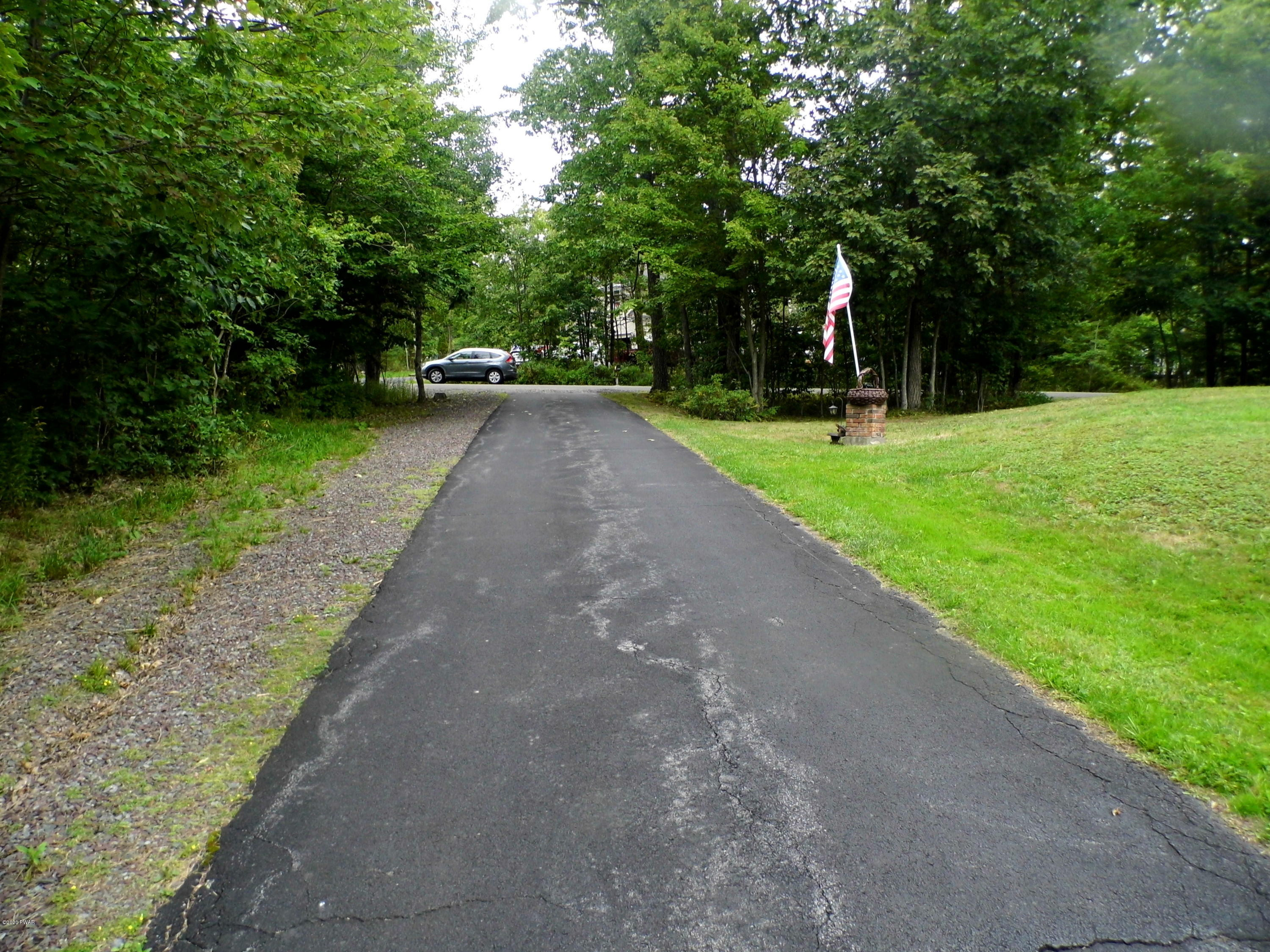 1360 Charles Road Lake Ariel, PA 18436 - Photo 2 of 17 a view of a park with large trees