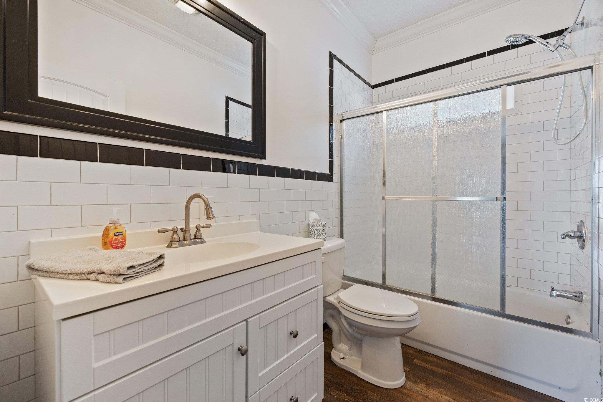 3565 Steamer Trace Road Conway, SC 29527 - Photo 20 of 40 Bathroom with ornamental molding, tile walls, wood