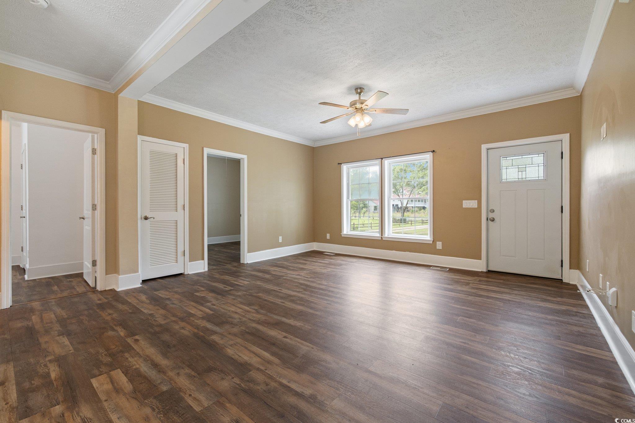 3565 Steamer Trace Road Conway, SC 29527 - Photo 3 of 40 Unfurnished living room featuring dark wood-style