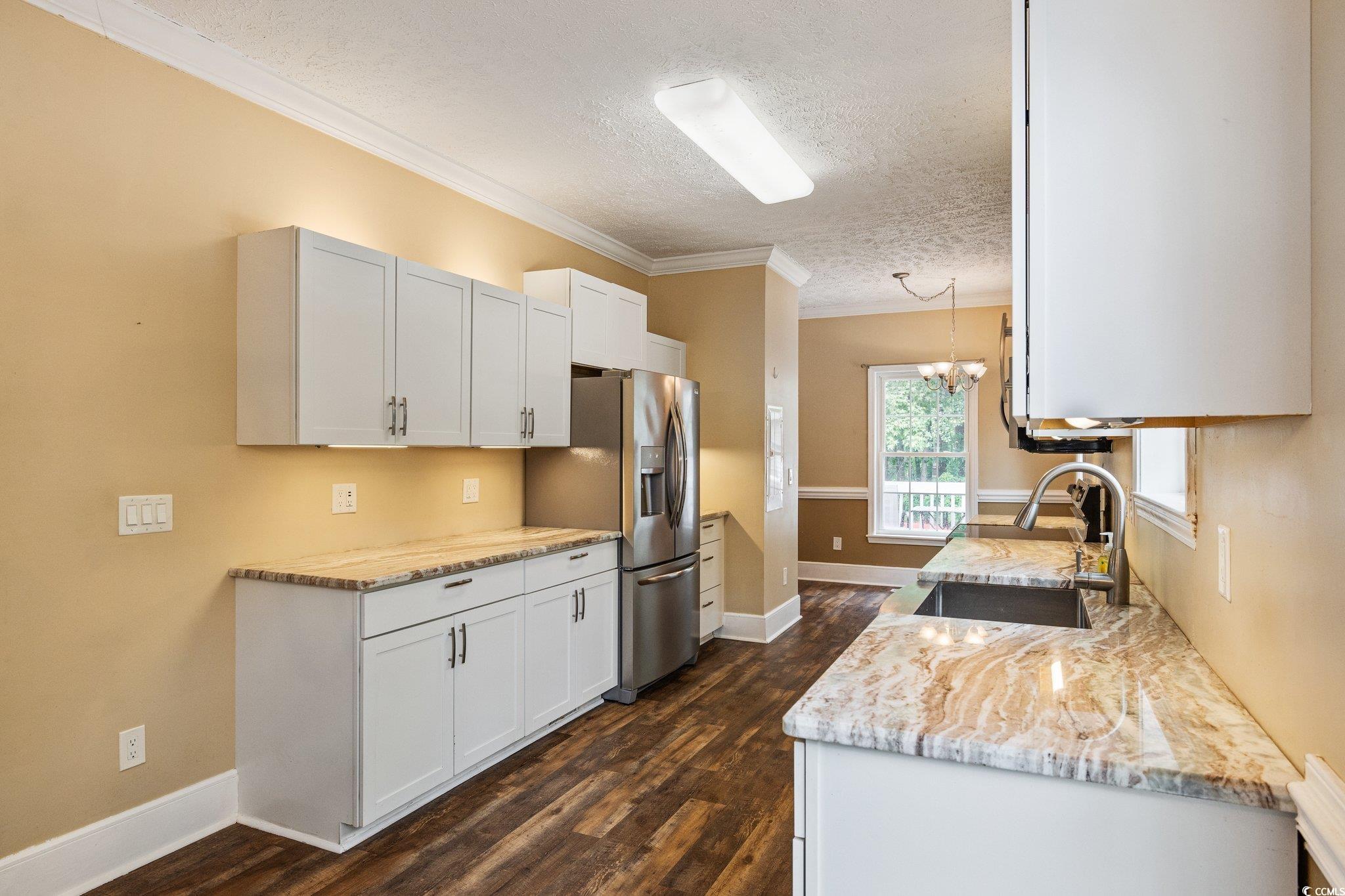 3565 Steamer Trace Road Conway, SC 29527 - Photo 10 of 40 Kitchen with a textured ceiling, a sink, dark wood