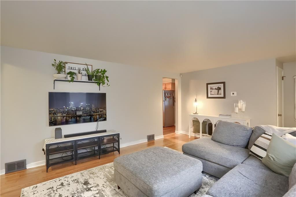 217 Lenore Drive McKees Rocks, PA 15136 - Photo 5 of 18 a living room with furniture and a flat screen tv