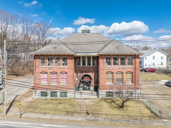 a front view of a house with swimming pool