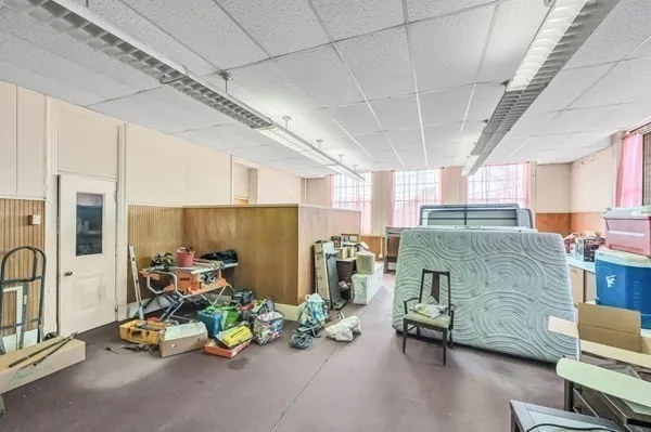 a bed room with a bed and a chair