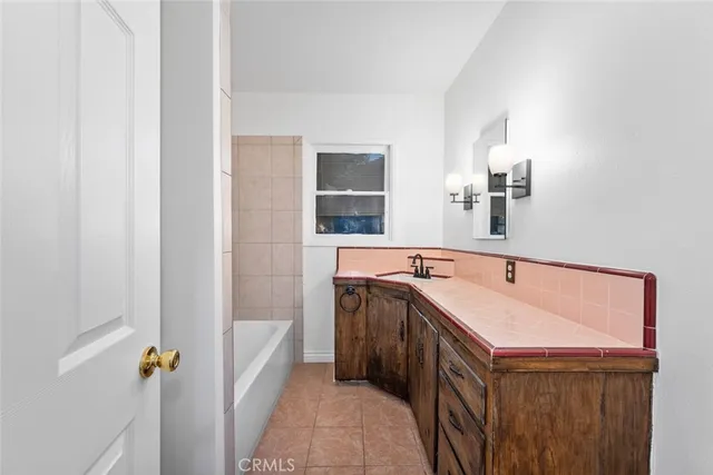 a bathroom with a sink a vanity and mirror