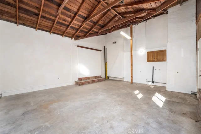 a view of empty room with ceiling fan