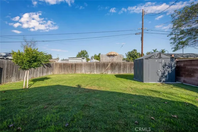 a view of a backyard with a garden and plants