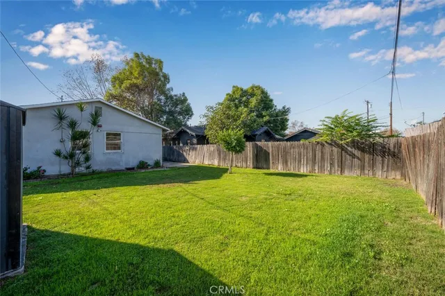 a backyard of a house with lots of green space