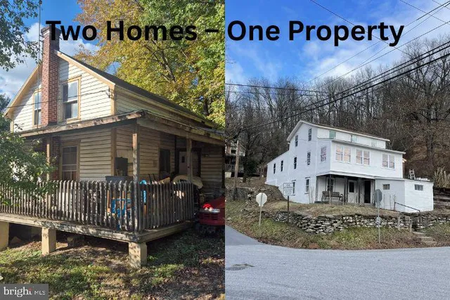 a view of small house with a yard