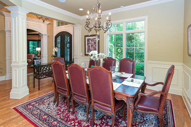 a view of a dining room with furniture window and wooden floor
