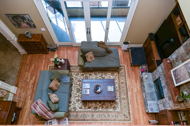 a kitchen with granite countertop a sink and a refrigerator