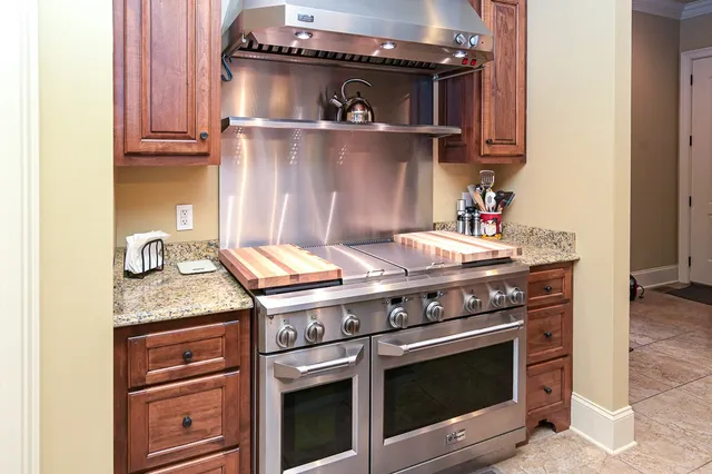 a bed room with a bed and a chandelier