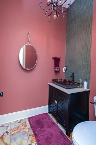 a bath tub sitting in a bathroom next to a window