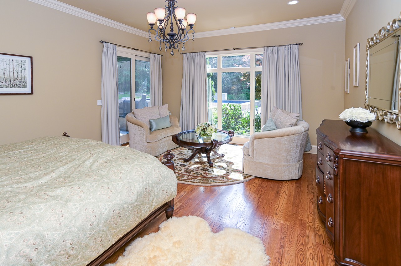 205 Nature Ridge Road Tullahoma, TN 37388 - Photo 25 of 58 a bed room with a bed and a chandelier