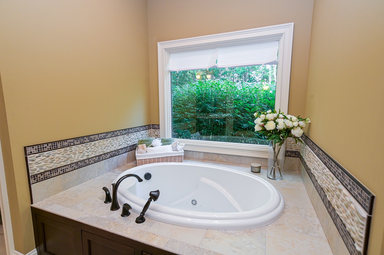 205 Nature Ridge Road Tullahoma, TN 37388 - Photo 28 of 58 a bath tub sitting in a bathroom next to a window