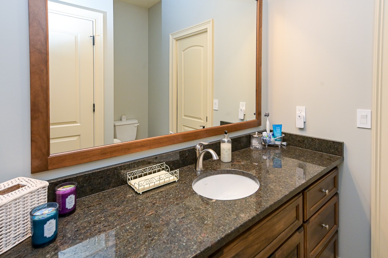 205 Nature Ridge Road Tullahoma, TN 37388 - Photo 40 of 58 a bathroom with a granite countertop sink and a mirror
