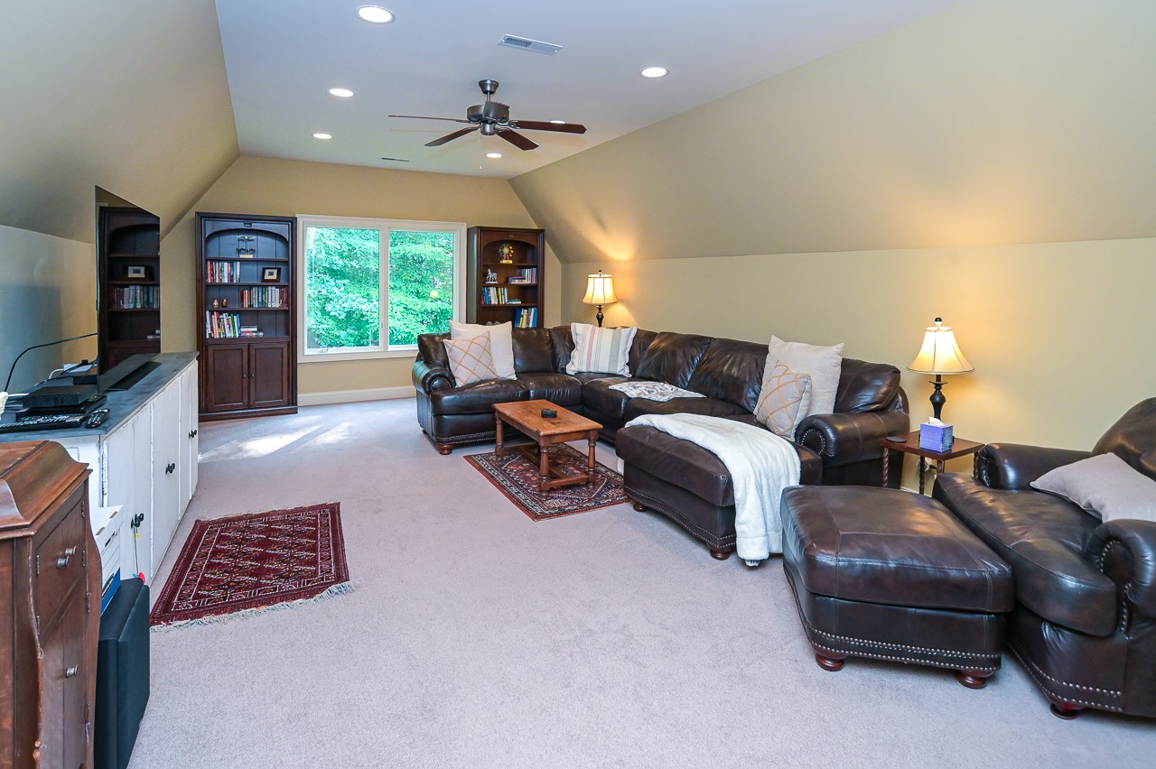 205 Nature Ridge Road Tullahoma, TN 37388 - Photo 43 of 58 a bedroom with furniture and a flat screen tv