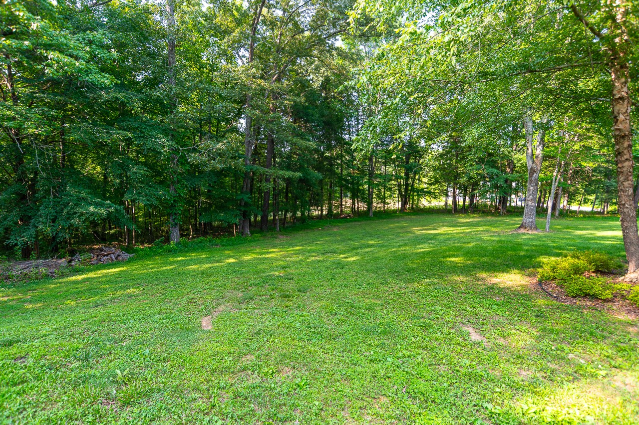 205 Nature Ridge Road Tullahoma, TN 37388 - Photo 44 of 58 a view of a grassy field with trees
