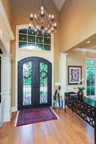 a view of a room with lots of windows and chandelier