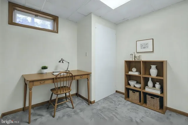 a view of a workspace with furniture