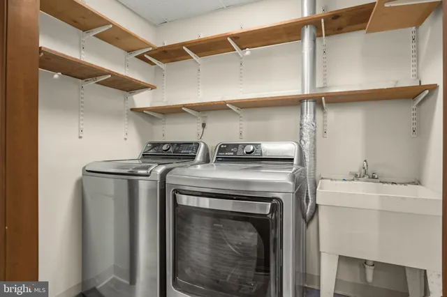 a view of storage and utility room with washer and dryer