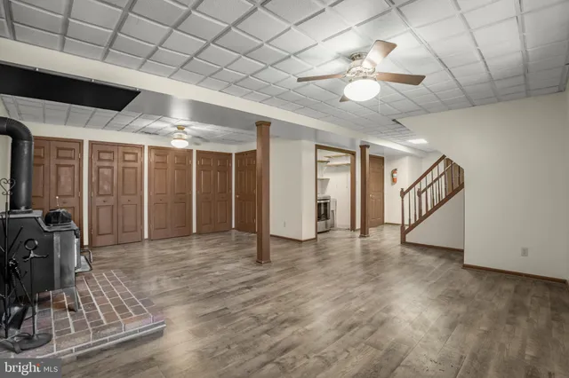 a view of an empty room with a chandelier