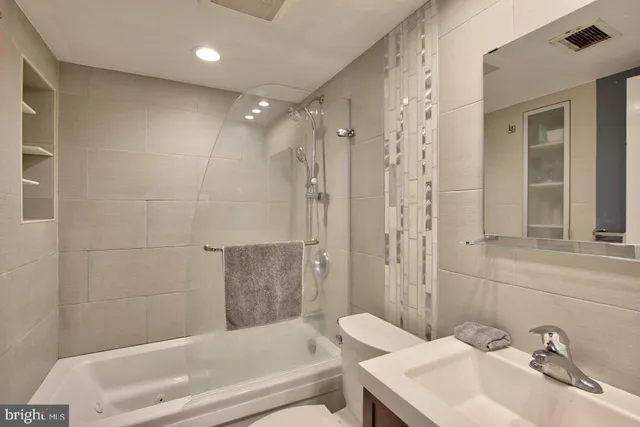 a bedroom with a bed and closet