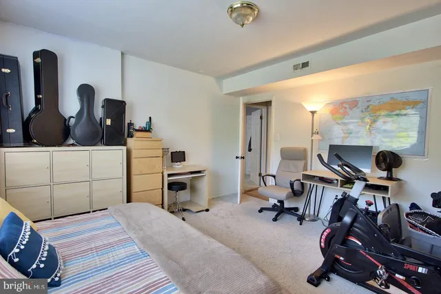 a view of a chair and table in backyard