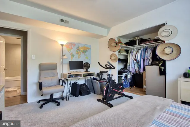 a view of a kitchen with a refrigerator and a stove