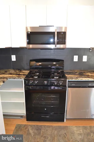 an empty room with closet area