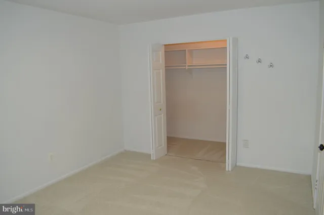 a kitchen with stainless steel appliances kitchen island a refrigerator sink and a stove