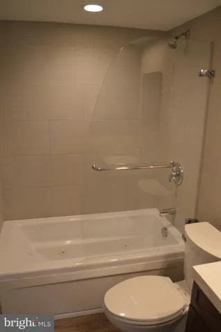 a view of a porch with a floor to ceiling window and wooden floor