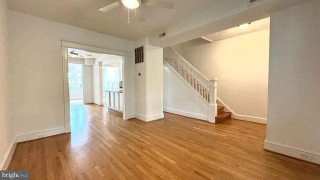 a view of an entryway with wooden floor and a fire place