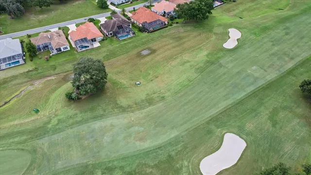 an aerial view of a house with a swimming pool