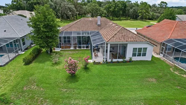 an aerial view of a house with outdoor space