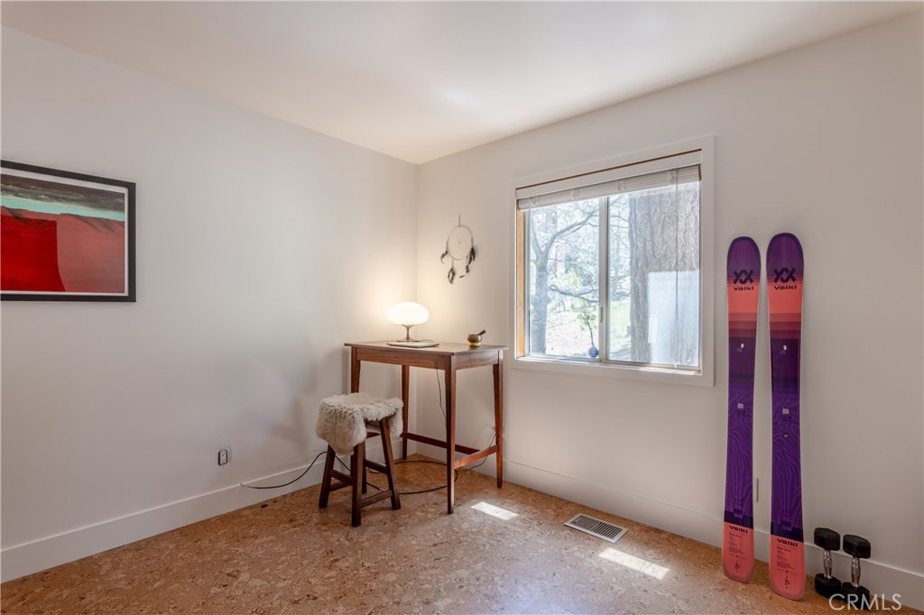 26704 Raven Road Wrightwood, CA 92397 - Photo 18 of 19 a view of a workspace with furniture and a window