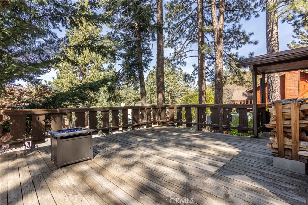 26704 Raven Road Wrightwood, CA 92397 - Photo 4 of 19 a view of a house with a wooden fence