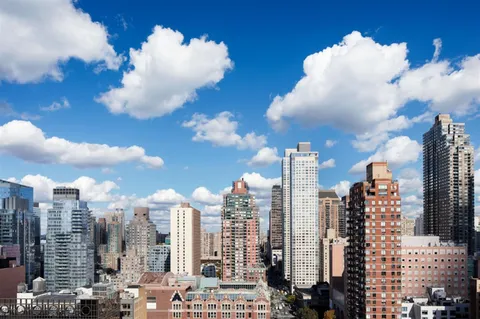 a view of a city with tall buildings