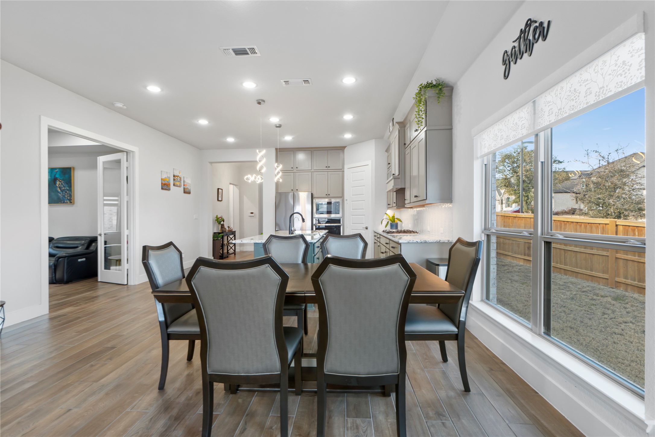 224 Grn Knl Lane Georgetown, TX 78628 - Photo 10 of 38 a view of a dining room with furniture window and wooden floor
