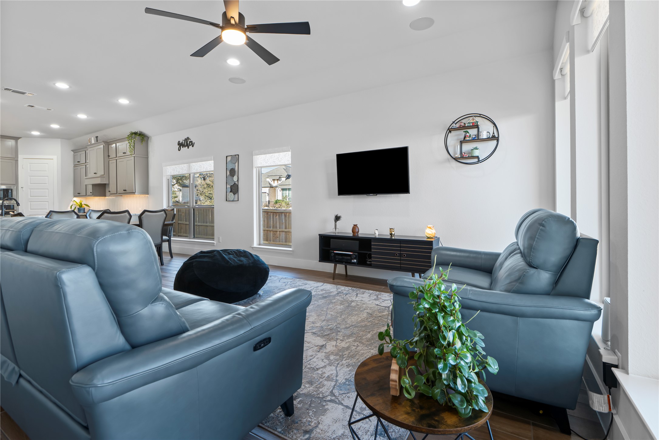 224 Grn Knl Lane Georgetown, TX 78628 - Photo 14 of 38 a living room with furniture and a flat screen tv