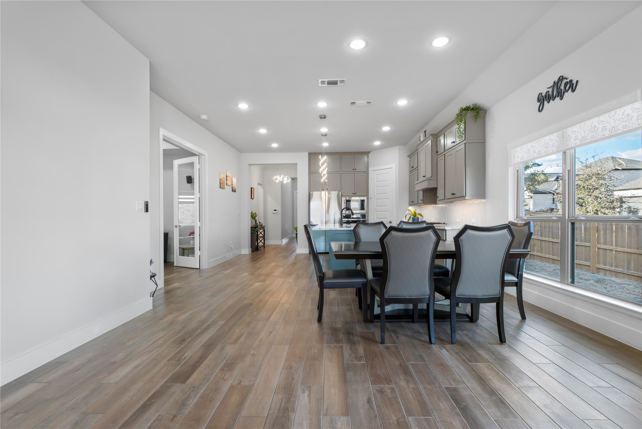 224 Grn Knl Lane Georgetown, TX 78628 - Photo 15 of 38 a view of a dining room with furniture and wooden floor