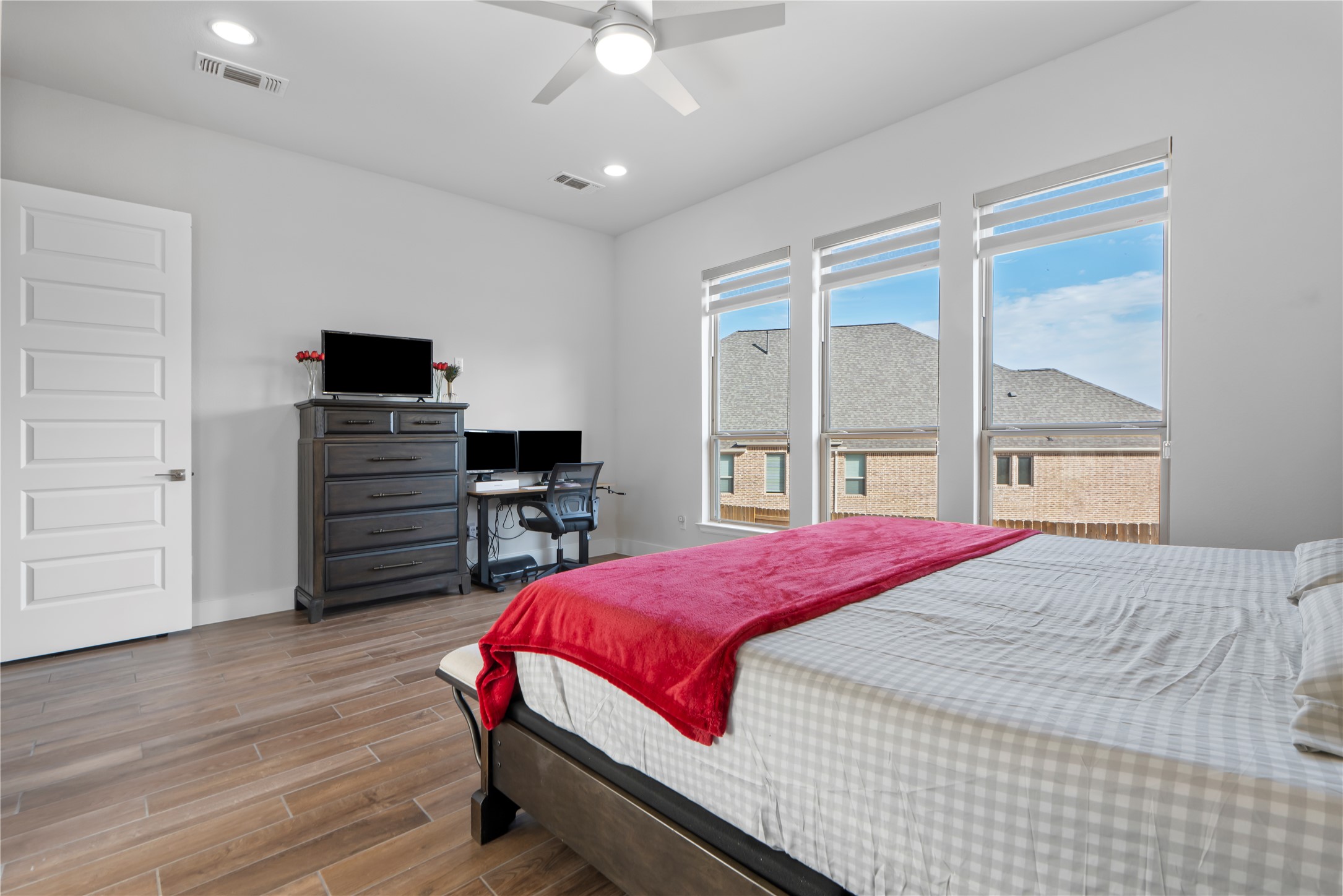 224 Grn Knl Lane Georgetown, TX 78628 - Photo 17 of 38 a bedroom with a bed and wooden floor