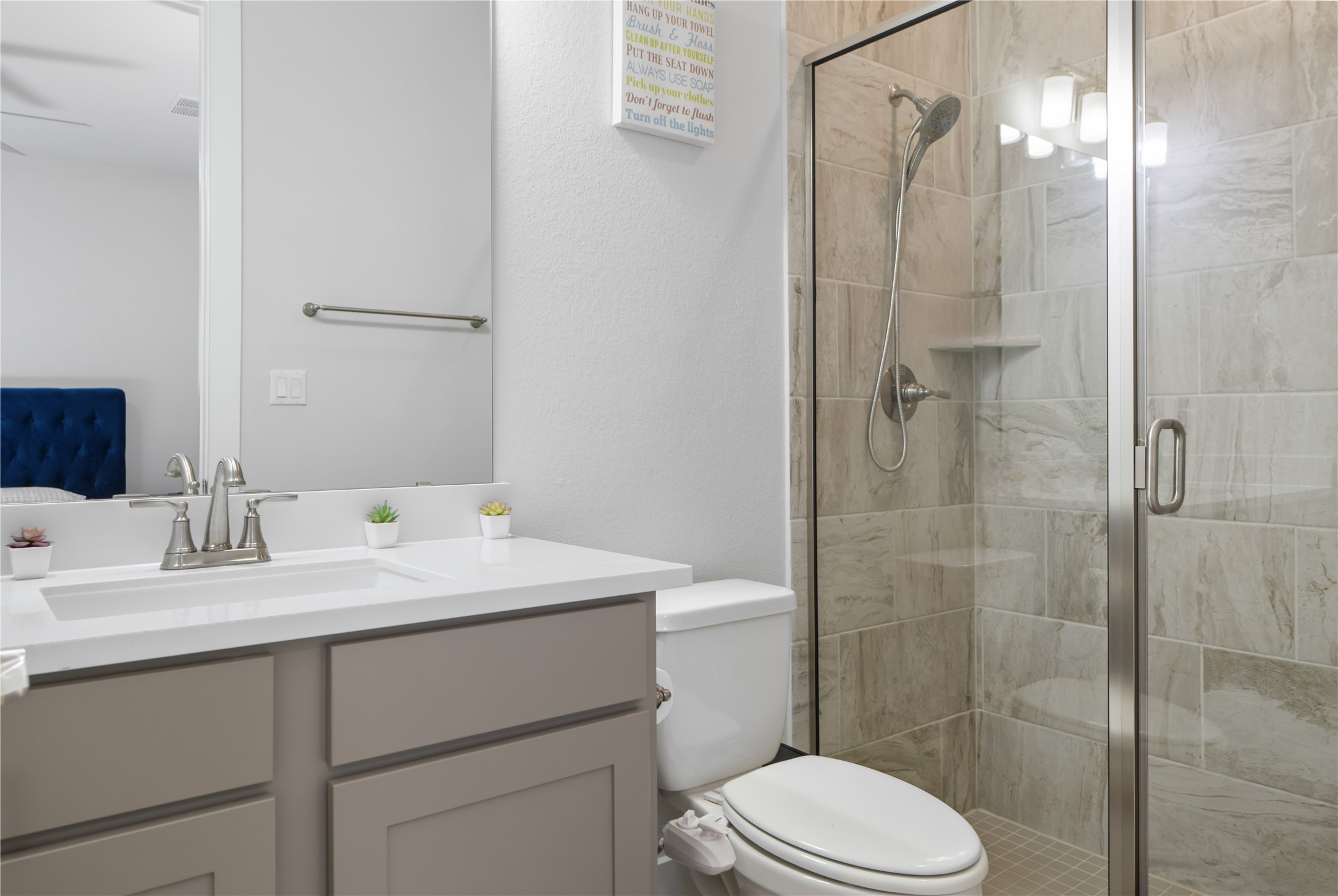 224 Grn Knl Lane Georgetown, TX 78628 - Photo 28 of 38 a bathroom with a sink toilet vanity and shower