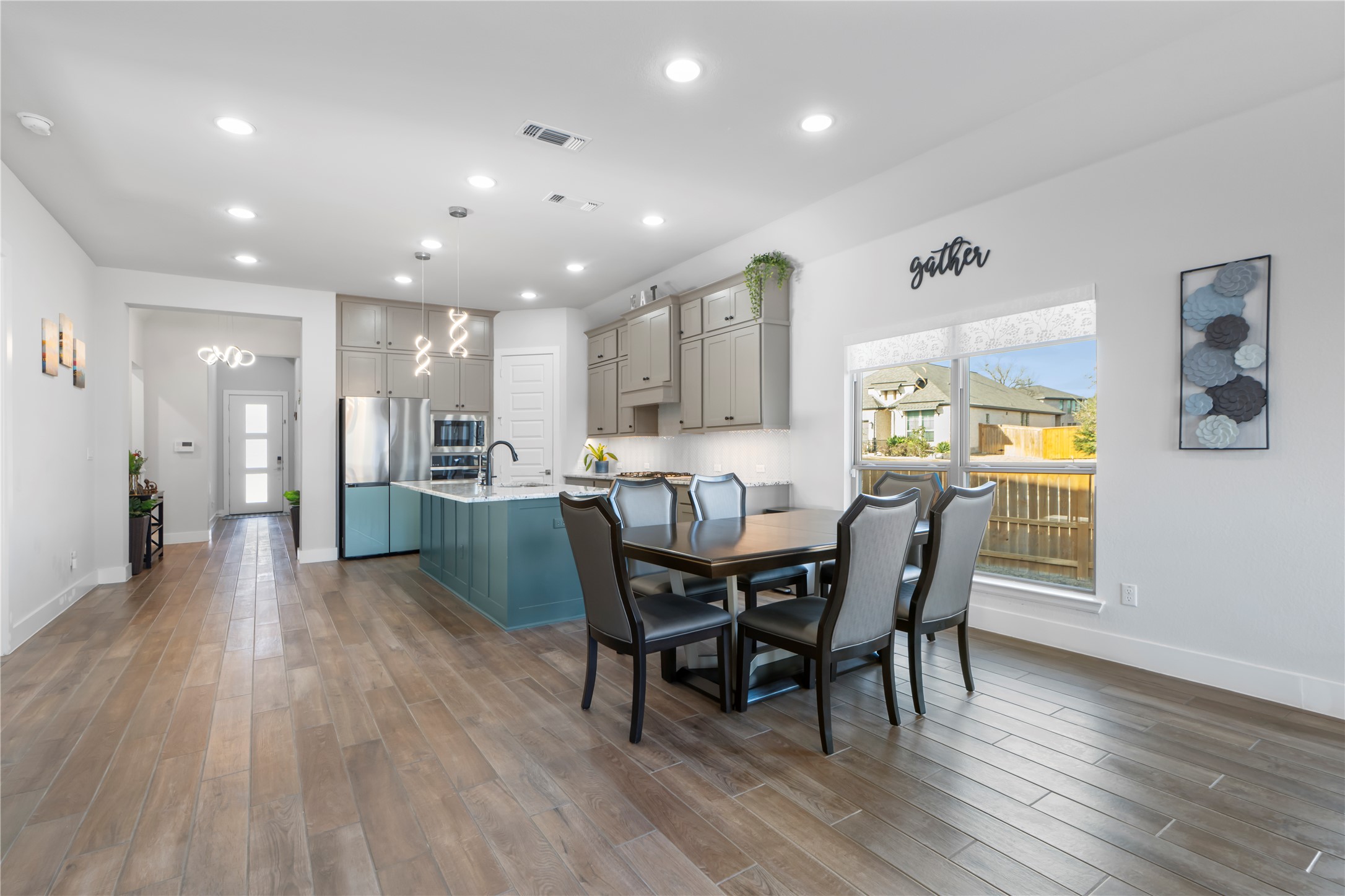 224 Grn Knl Lane Georgetown, TX 78628 - Photo 7 of 38 a view of a dining room with furniture and wooden floor