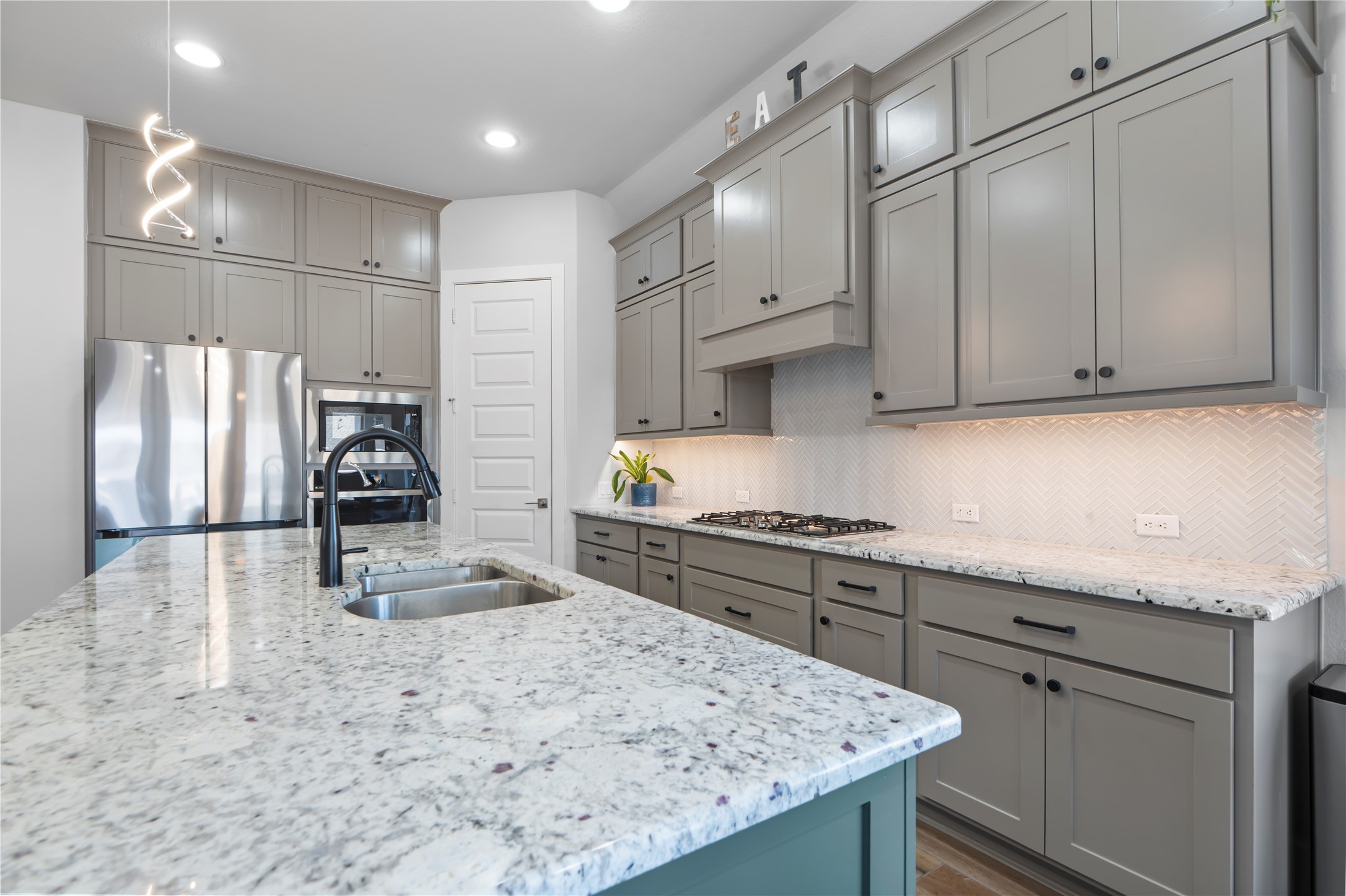 224 Grn Knl Lane Georgetown, TX 78628 - Photo 8 of 38 a kitchen with stainless steel appliances granite countertop a sink refrigerator and cabinets